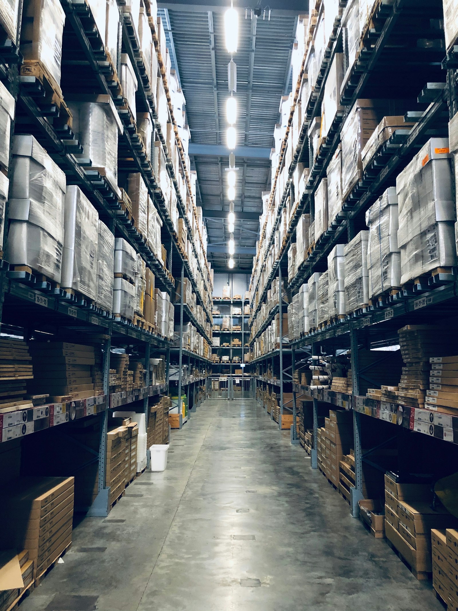 High-bay warehouse aisle with racking
